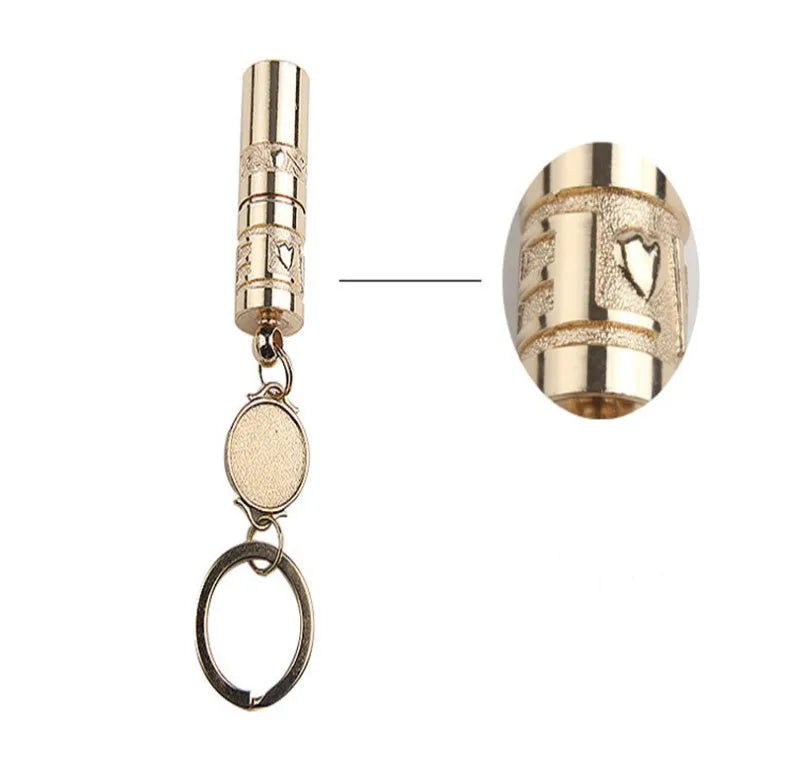 Gold-coloured waterproof mini LED keychain flashlight with zinc alloy housing on a key ring.