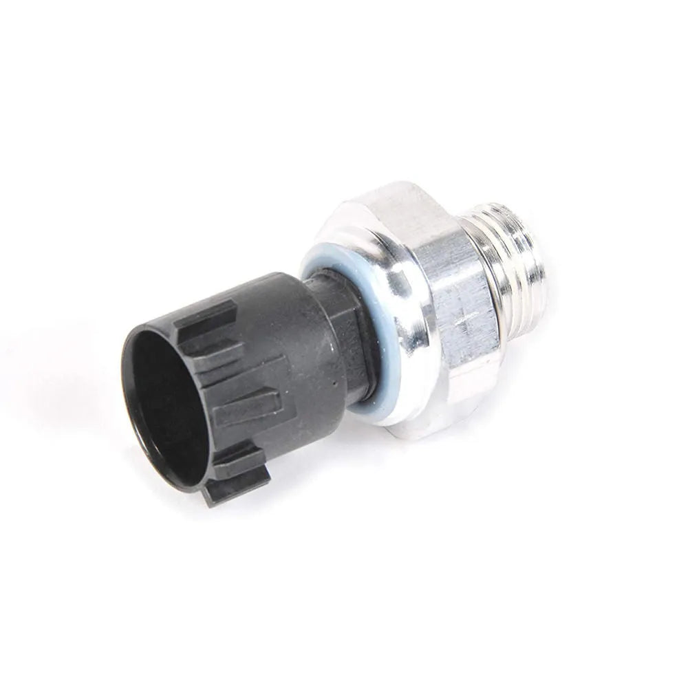 Silver metal automobile fuel pressure sensor on a plain background