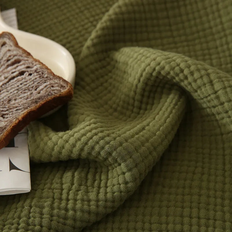 Four-layer cotton gauze blanket with tassel edge in a choice of ten colours.