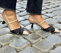 Apricot black colour block women's stiletto heel sandals with pointed toe and ankle buckle.