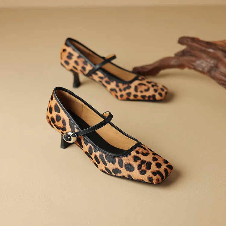 Women's black ankle-strap stiletto heels with a horse hair upper and square toe.