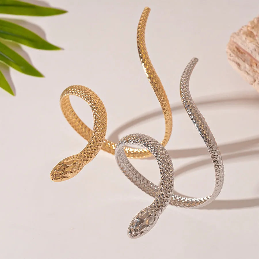 Snake-inspired ring and bracelet set with exaggerated twisted winding design in electroplated metal