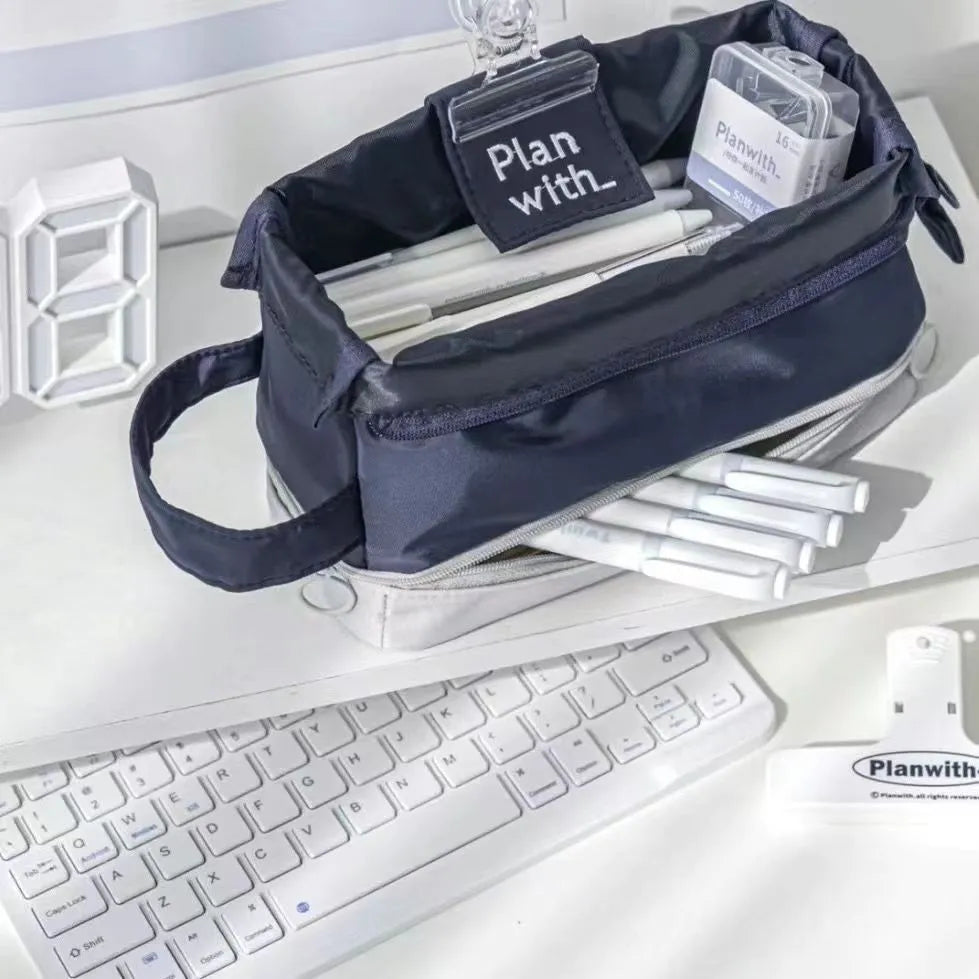 Polyester student pencil case showing double-layer design in dark blue, blue, and cream white colour options