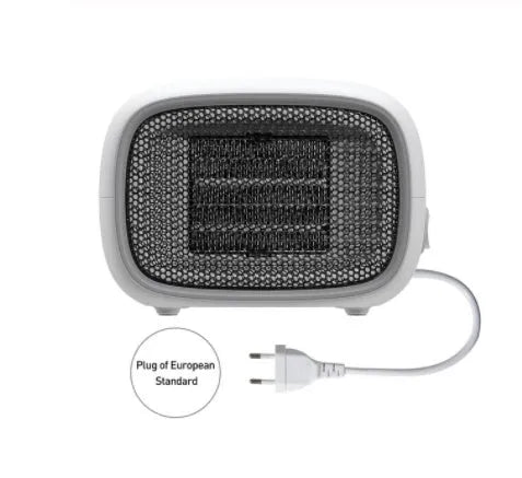 Compact green mini ceramic heater with metal mesh grille on a desk