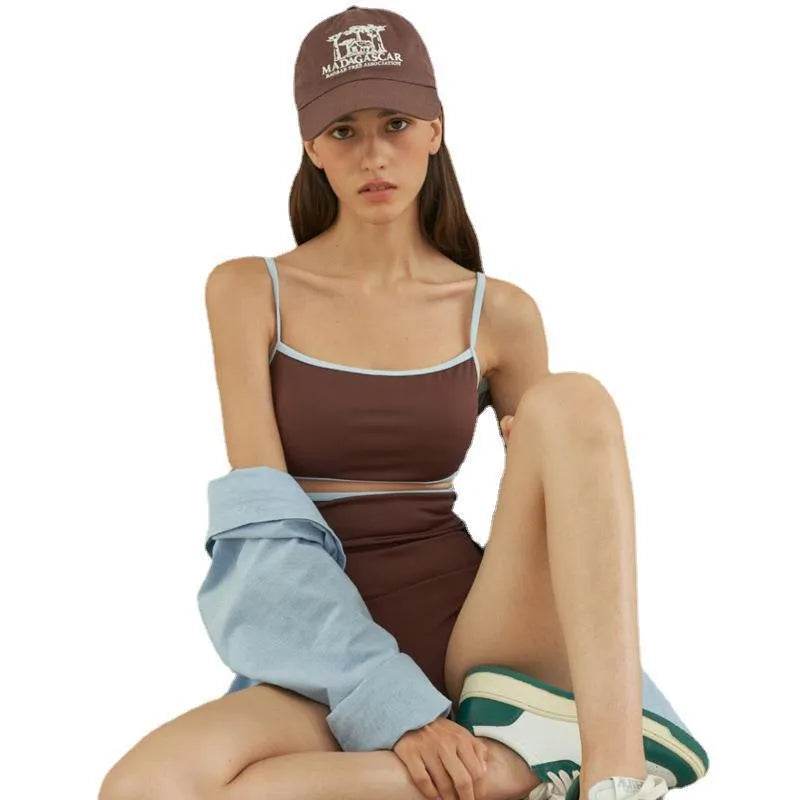 Brown triangle cut one-piece swimsuit for women on hanger showing front design