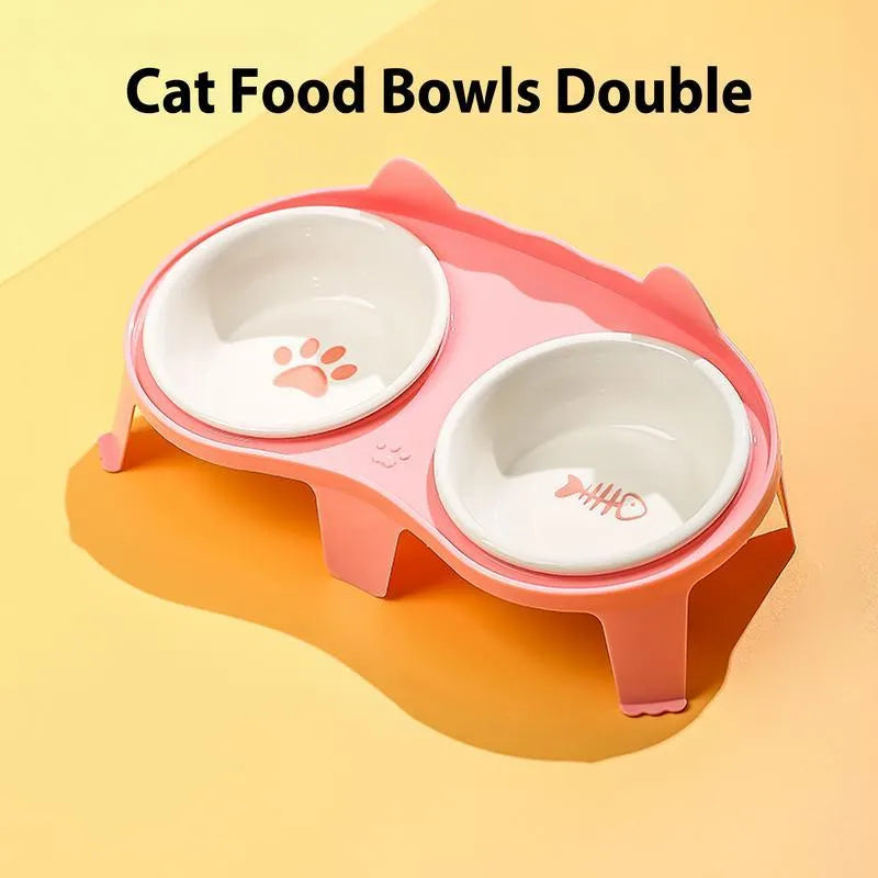 Blue ceramic cat food and water bowls on a white elevated stand with a storage hook.