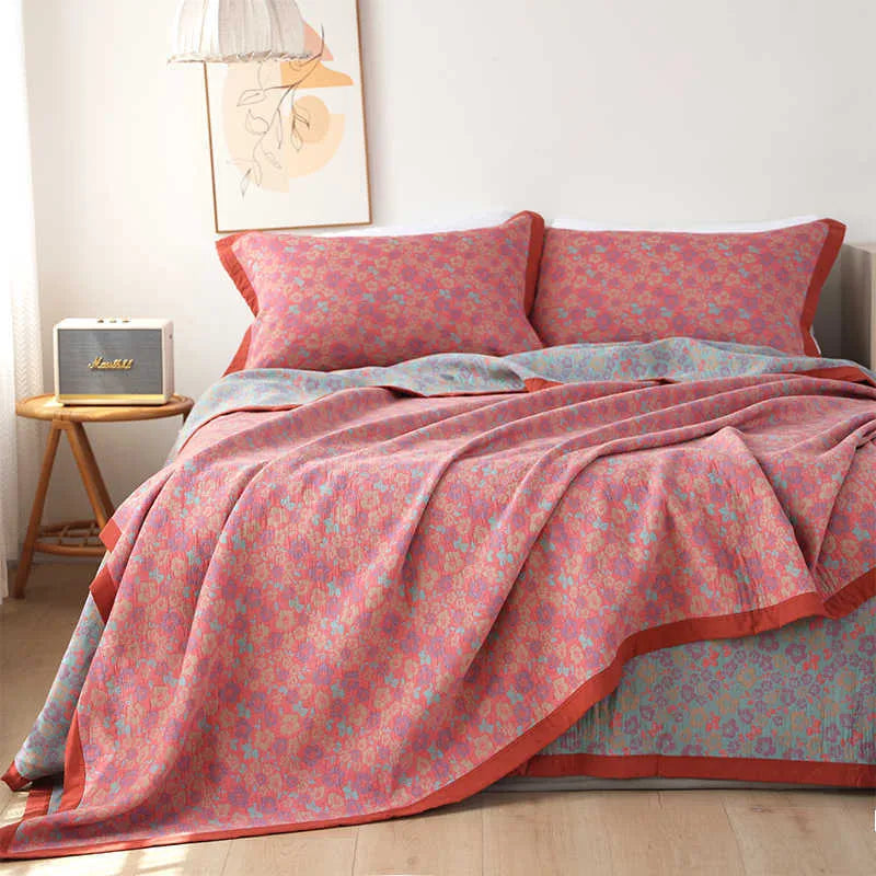 Cotton gauze bed blanket three-piece set with floral pattern showing blanket and two pillowcases