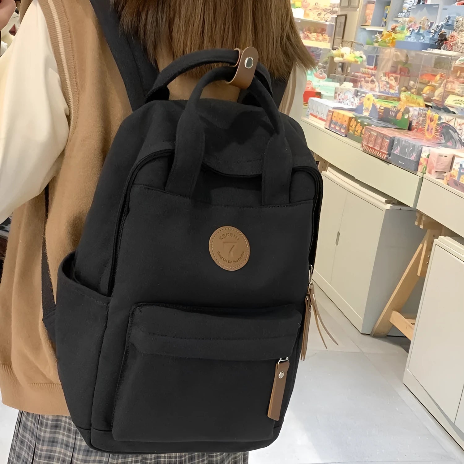 Black Oxford cloth backpack with curved shoulder straps