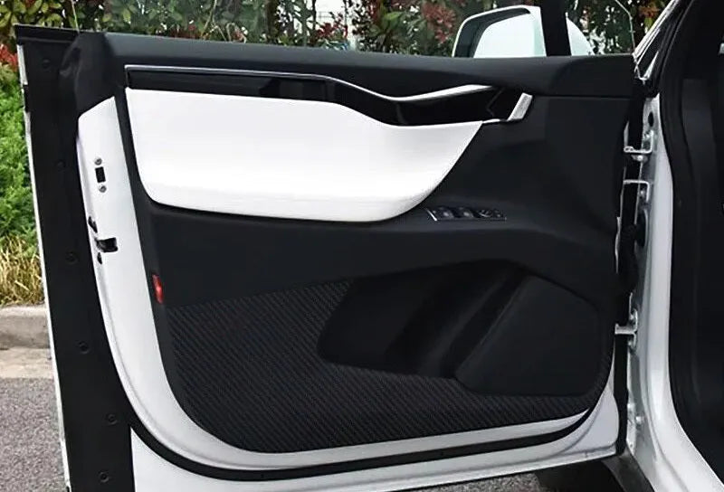 Carbon fibre protective film kit for Tesla Model S doors showing four pre-cut pieces