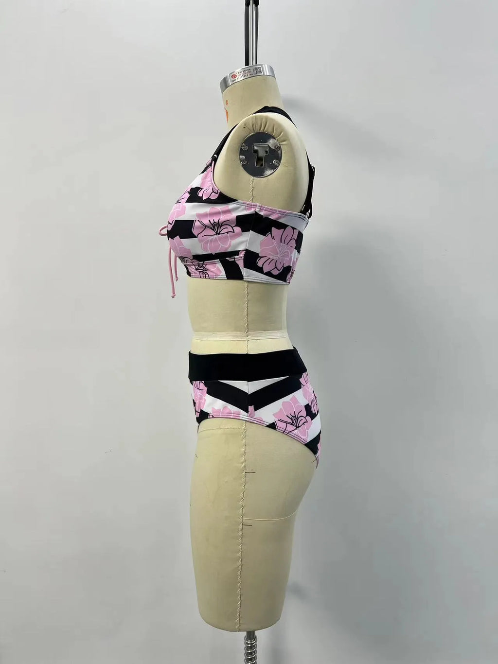 Black women's printed bikini set with belly-covered slimming design for swimming.