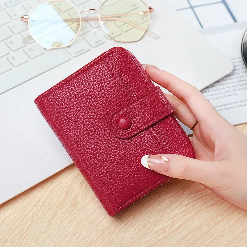 Ladies fold wallet with lychee pattern in PU leather showing beige, pink, black and red colour options