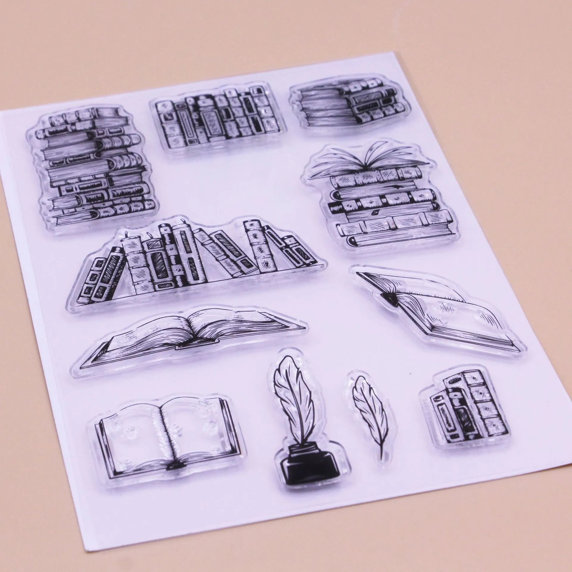 Large transparent silicone craft stamp with self-adhesive backing on a white background.