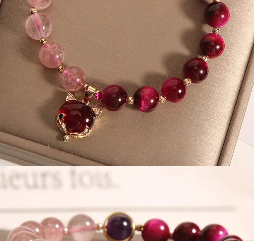 Women's simple strawberry crystal elastic bracelet showing natural stones on stretchable 18cm band
