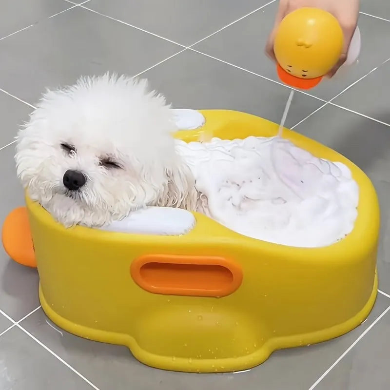 Blue PVC duck-shaped bathtub for washing a dog or cat at home.