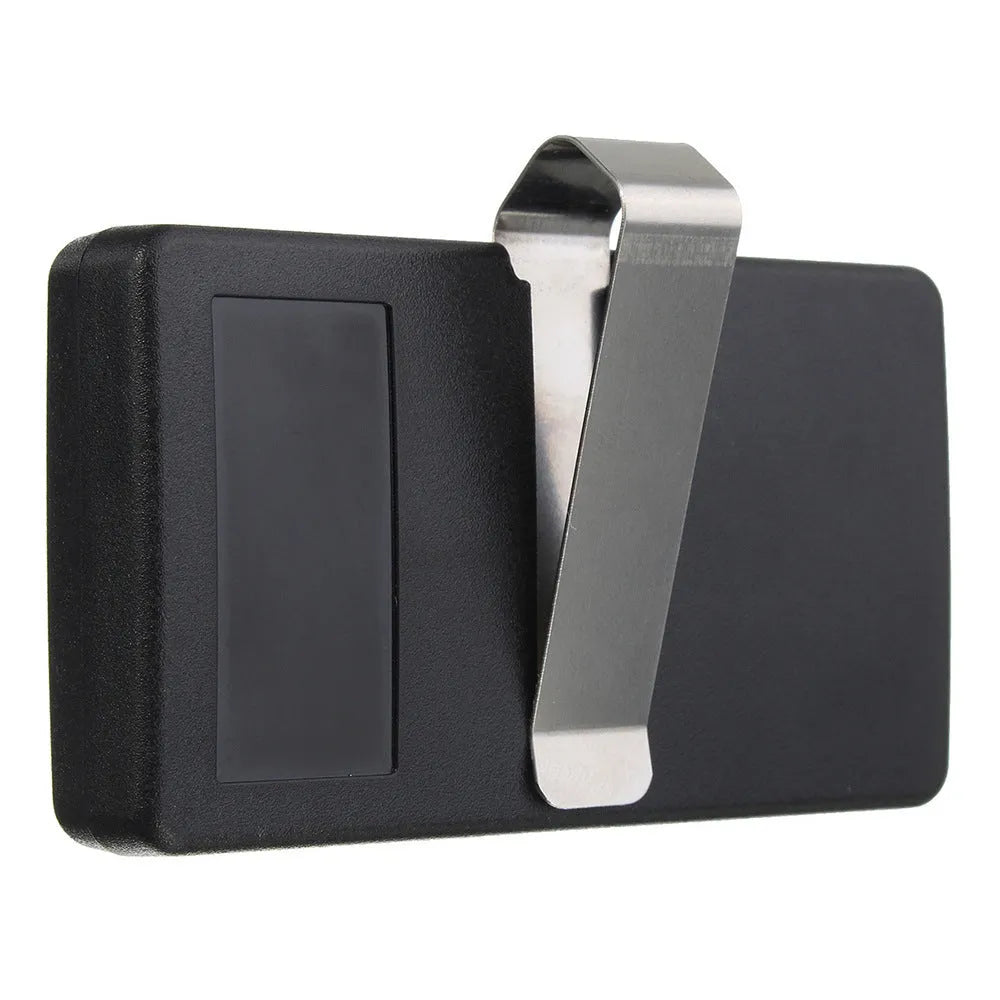 Black three-button garage door remote control with keyring loop next to a CR2032 battery.