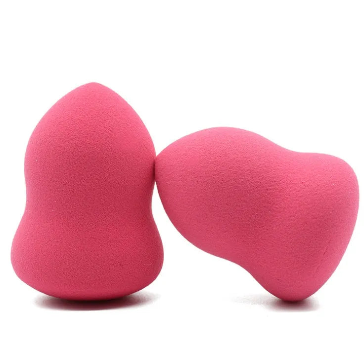 Pink makeup foundation sponge with soft texture measuring 4cm by 4cm by 5.6cm
