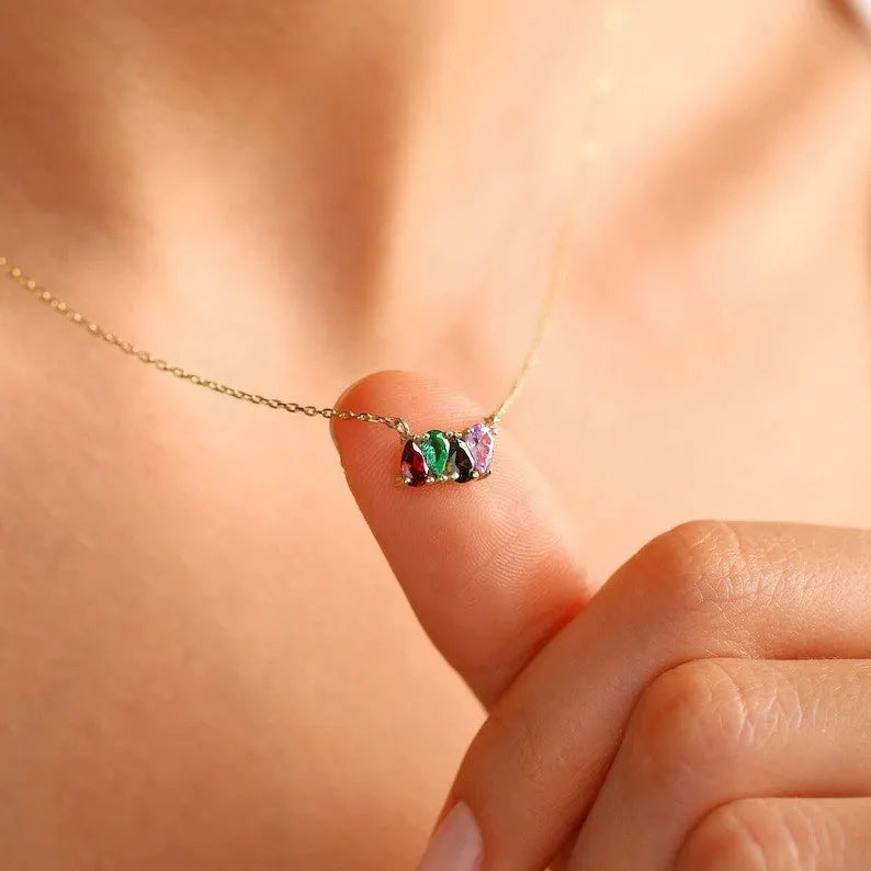 Zircon and diamond birthstone necklace on a titanium steel clavicle chain in rose gold, showing the April pendant style.
