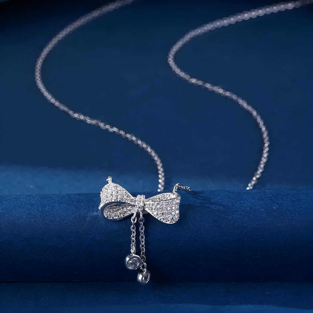 S925 sterling silver necklace with bow pendant on O-ring chain, silver colour.