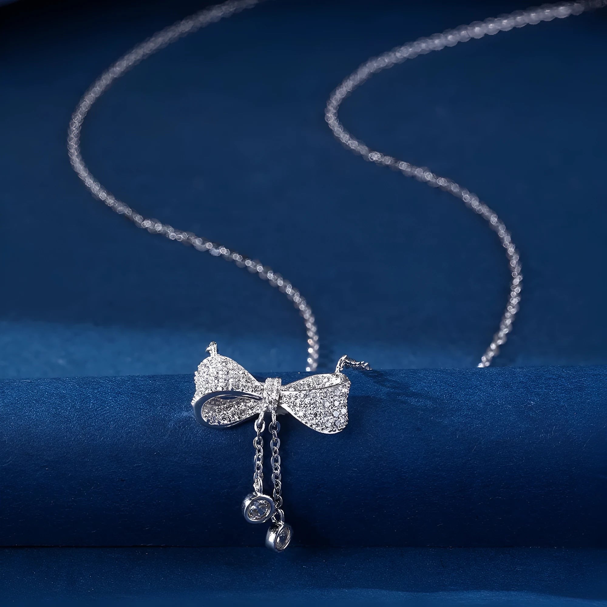 S925 sterling silver necklace with bow pendant on O-ring chain, silver colour.