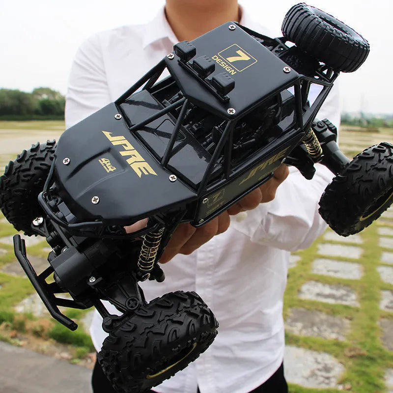 Black and silver remote control cars showcasing 28cm and 37cm four-wheel drive models with wireless controllers