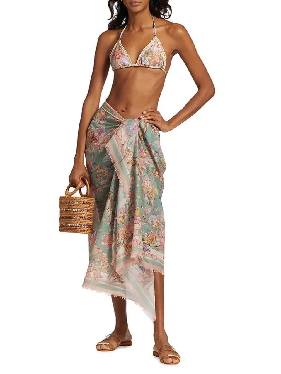 Women's creamy-white floral bikini set with top, briefs, and skirt for beach swimming