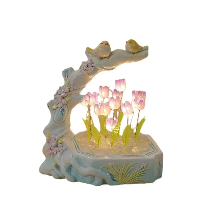 Resin tulip-shaped decorative night light assembled from DIY material package on a desk.