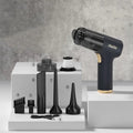 Black wireless handheld car vacuum cleaner with multiple nozzle attachments on display