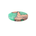 Nordic style wooden coaster with heat insulation resin in green, round tumour design.
