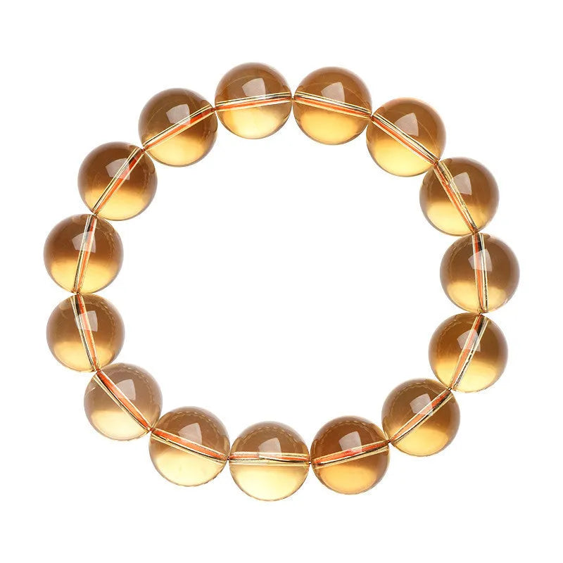 Natural citrine scattered bead ball bracelet showing 7A and 6A colour grades on a model's wrist.