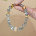 Emerald green Tian Shan Cui stone women's bracelet with floating floral motif and circular pattern