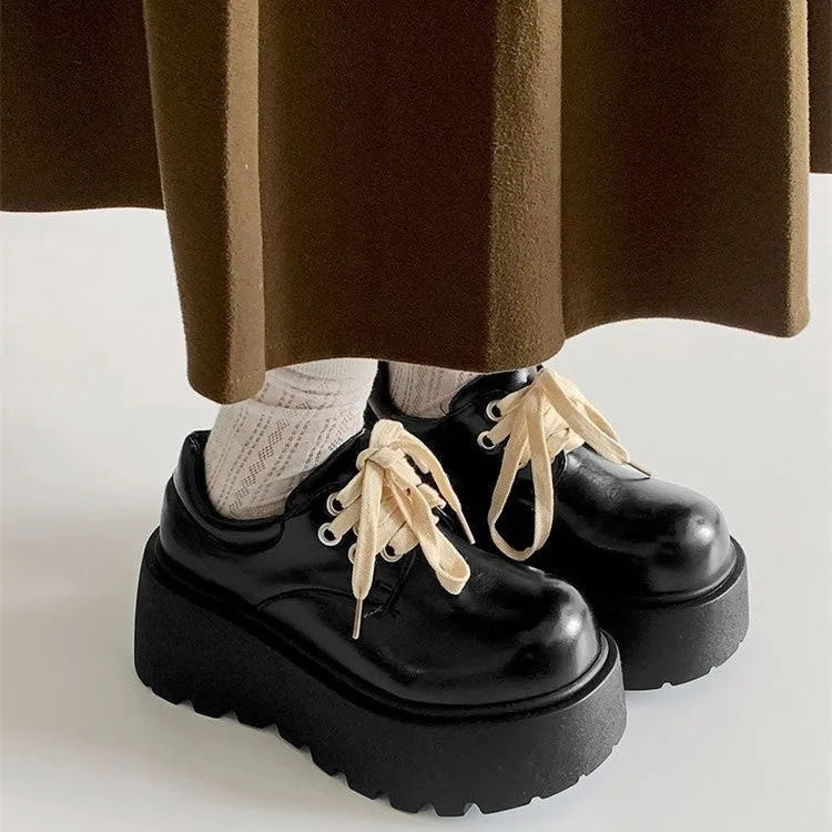 Women's matte black lace-up shoes with thick rubber sole and chunky 6-8cm heel, round toe.