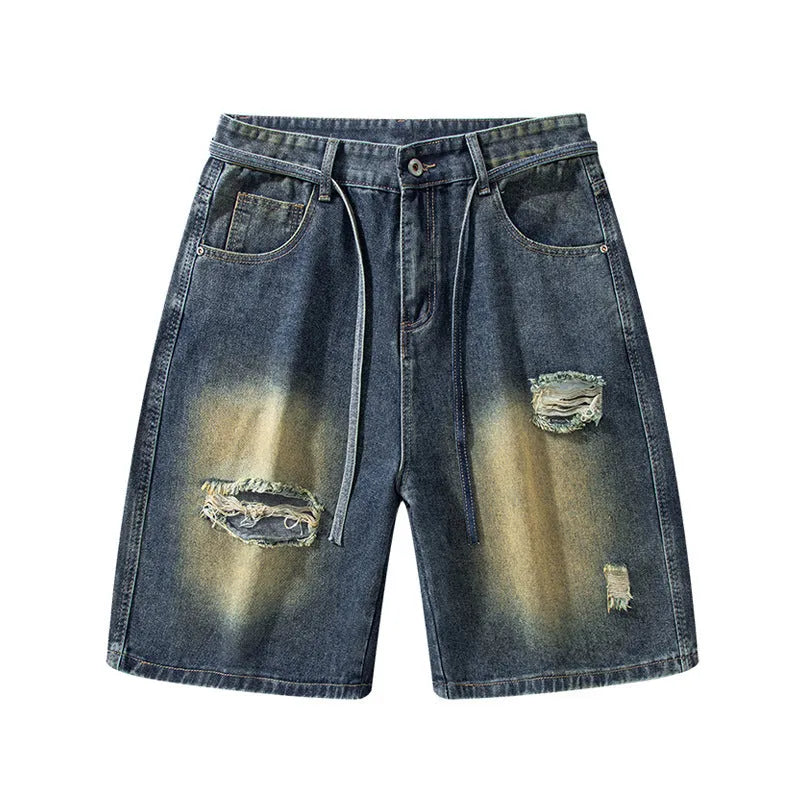 Retro blue loose fit ripped jeans with distressed detailing and street style design
