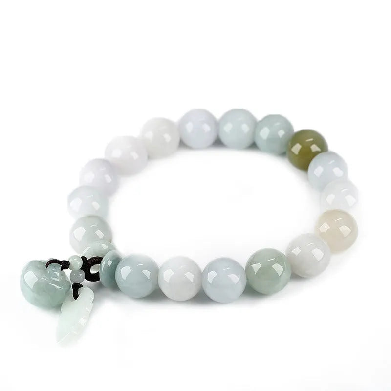 Natural green jade bracelet with a hanging Maitreya Buddha charm on a wrist.