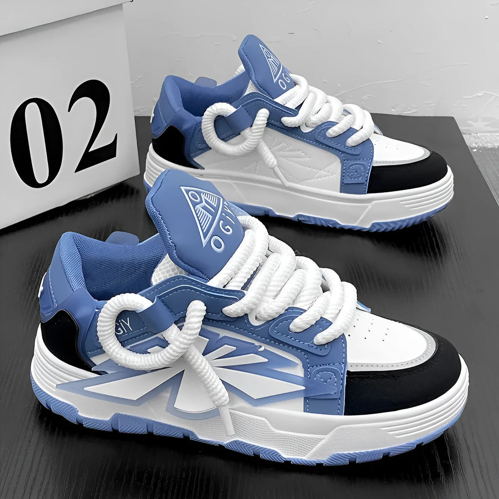 Men's white chunky sneakers with cartoon design, thick rubber sole, and lace-up front.