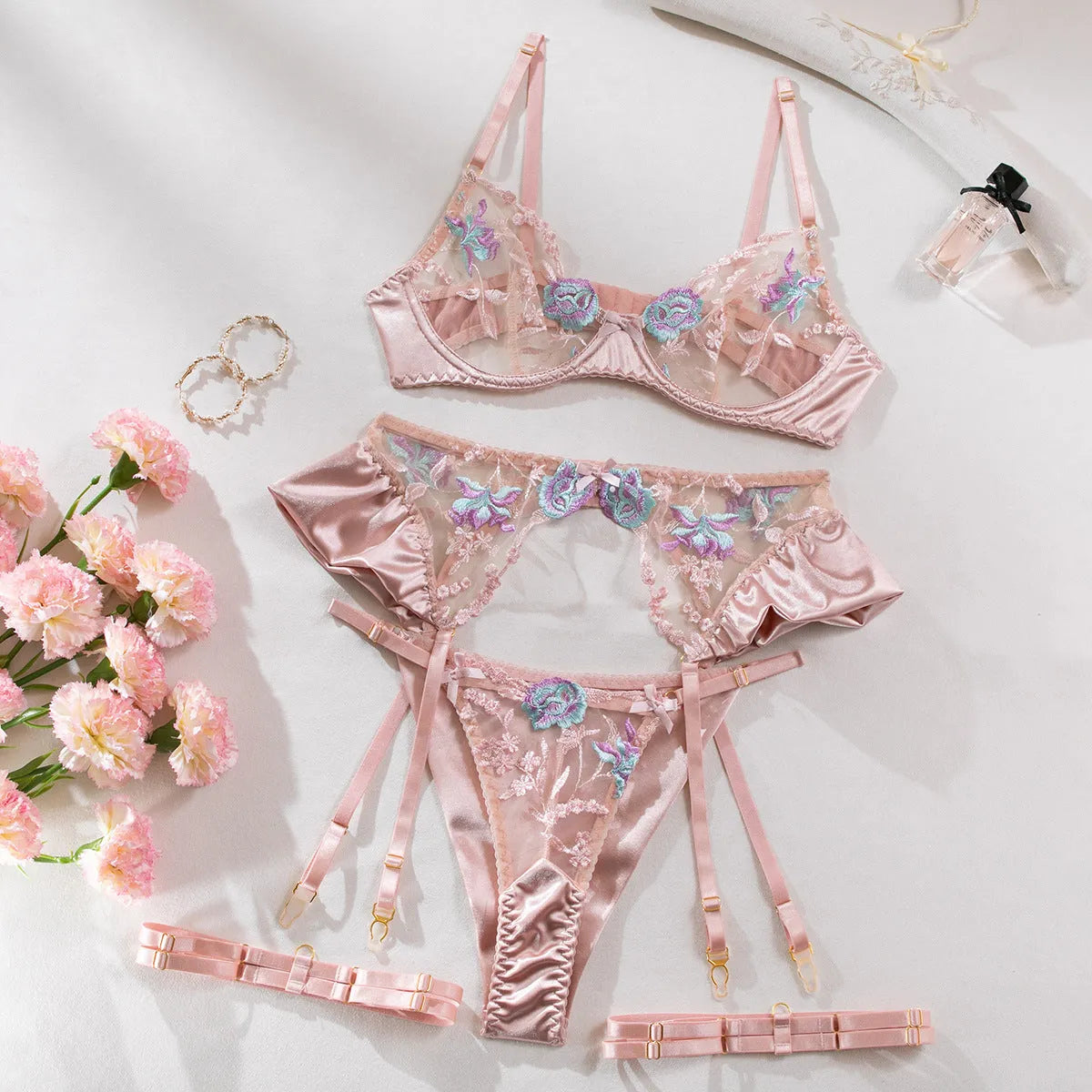 Light purple satin four-piece lingerie set shown alongside champagne colour option.