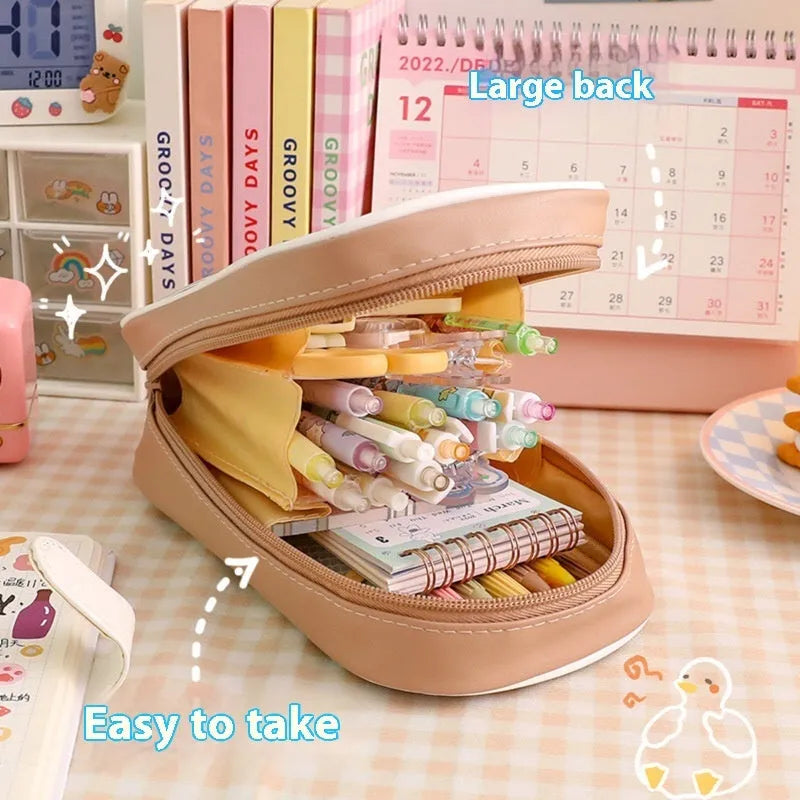 Transparent PVC pencil case with cartoon design options including caramel bear, pink floral rabbit, and water blue happy dog patterns