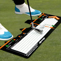 Black neoprene golf swing posture training pad on a green surface
