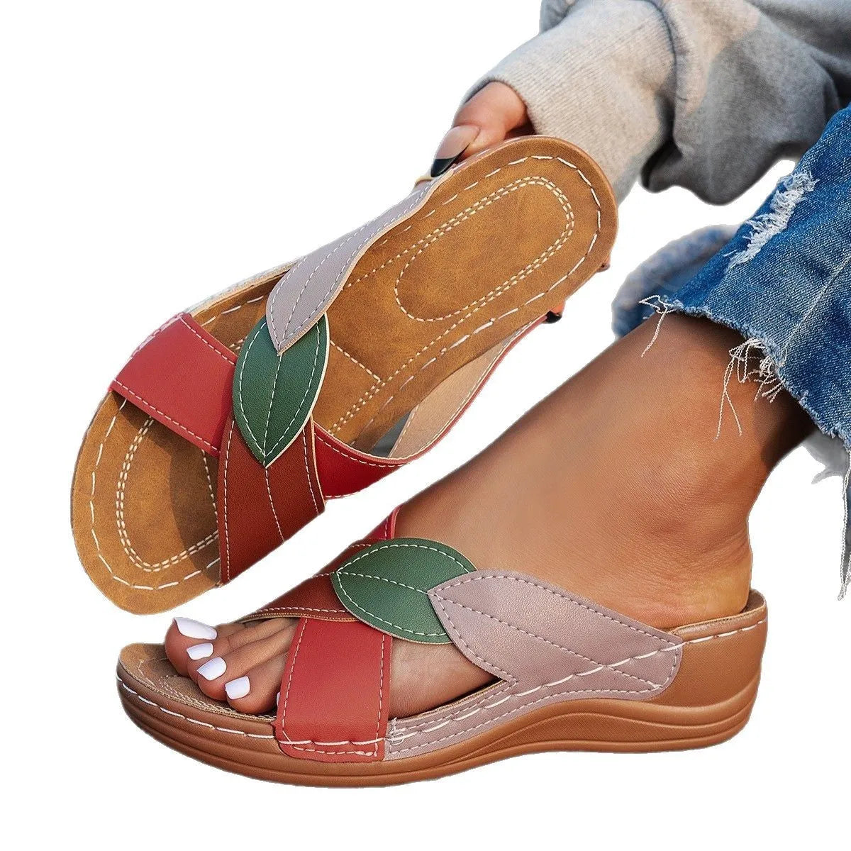 Women's black cross-strap peep-toe slippers with a thick sole, shown from the side.