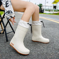 Women's solid colour PVC rain boot in apricot, featuring a non-slip sole and waterproof mouth design.