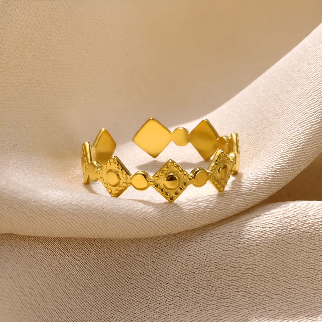 Gold titanium steel women's ring with geometric diamond design