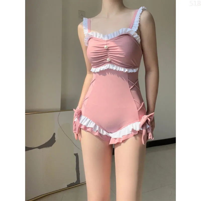 Women's one-piece milk silk swimsuit in solid pink colour with sleeveless design, available in sizes S to XL