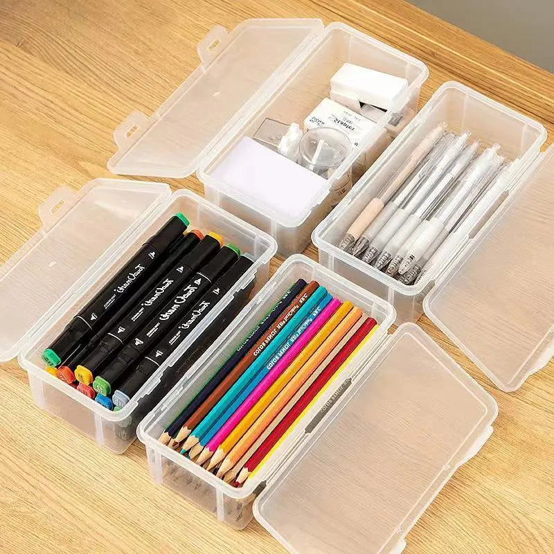 Transparent plastic stationery storage box with pencils and crayons inside