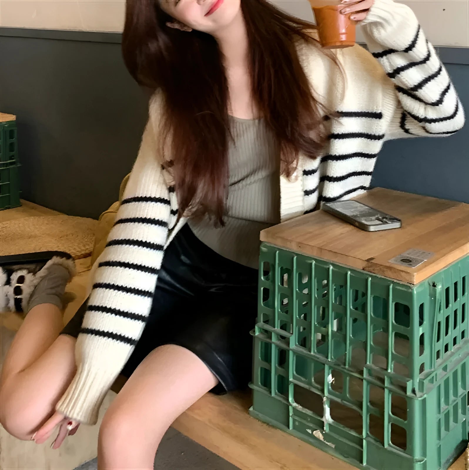 Women's button-down cardigan sweater with a 3D texture pattern in a casual style.