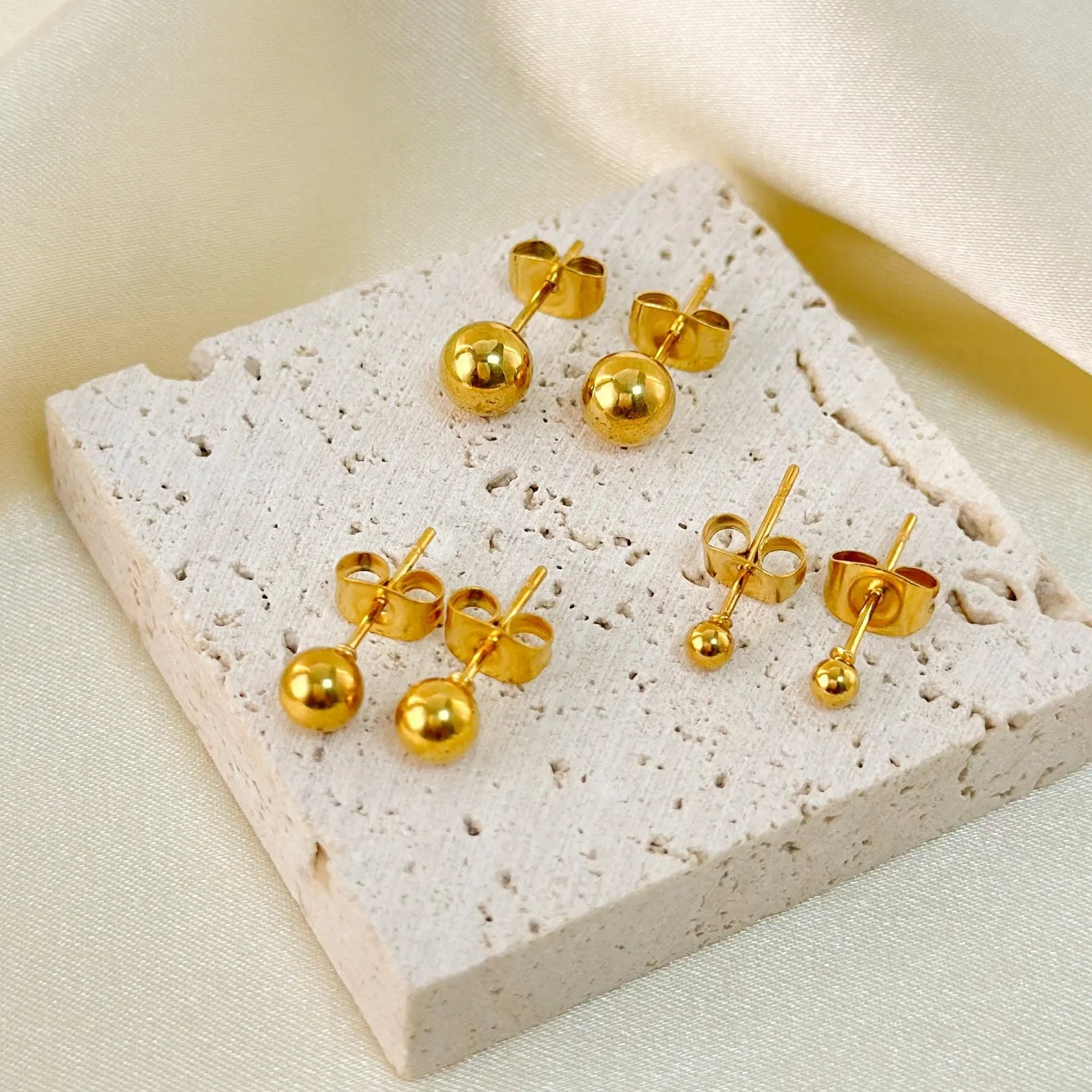 Stainless steel ball stud earrings with gold or silver electroplated finish in 3mm to 6mm sizes