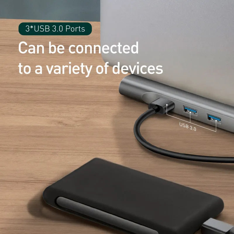 Grey aluminium alloy ten port docking station with integrated laptop cooling bracket showing HDMI, VGA, and USB ports
