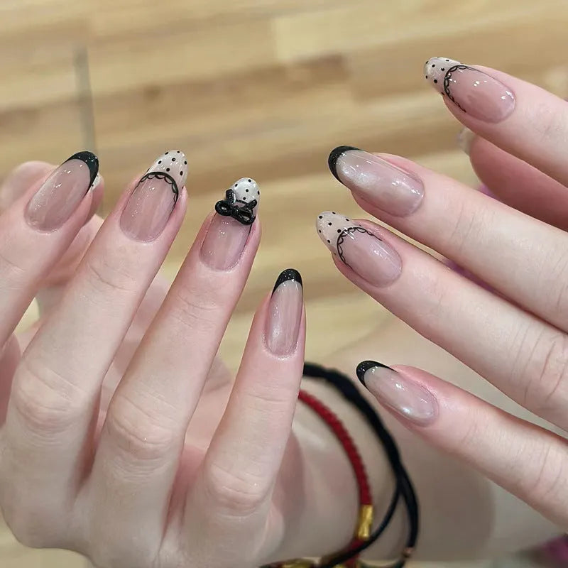 A pack of five pairs of long square-shaped false nails in assorted colours and patterns.