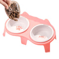Blue ceramic cat food and water bowls on a white elevated stand with a storage hook.