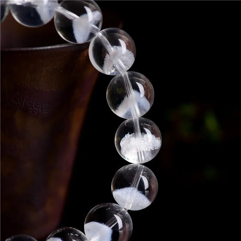 Women's white crystal bracelet with a pyramid charm and Ruyi symbol, showing different bead size options.