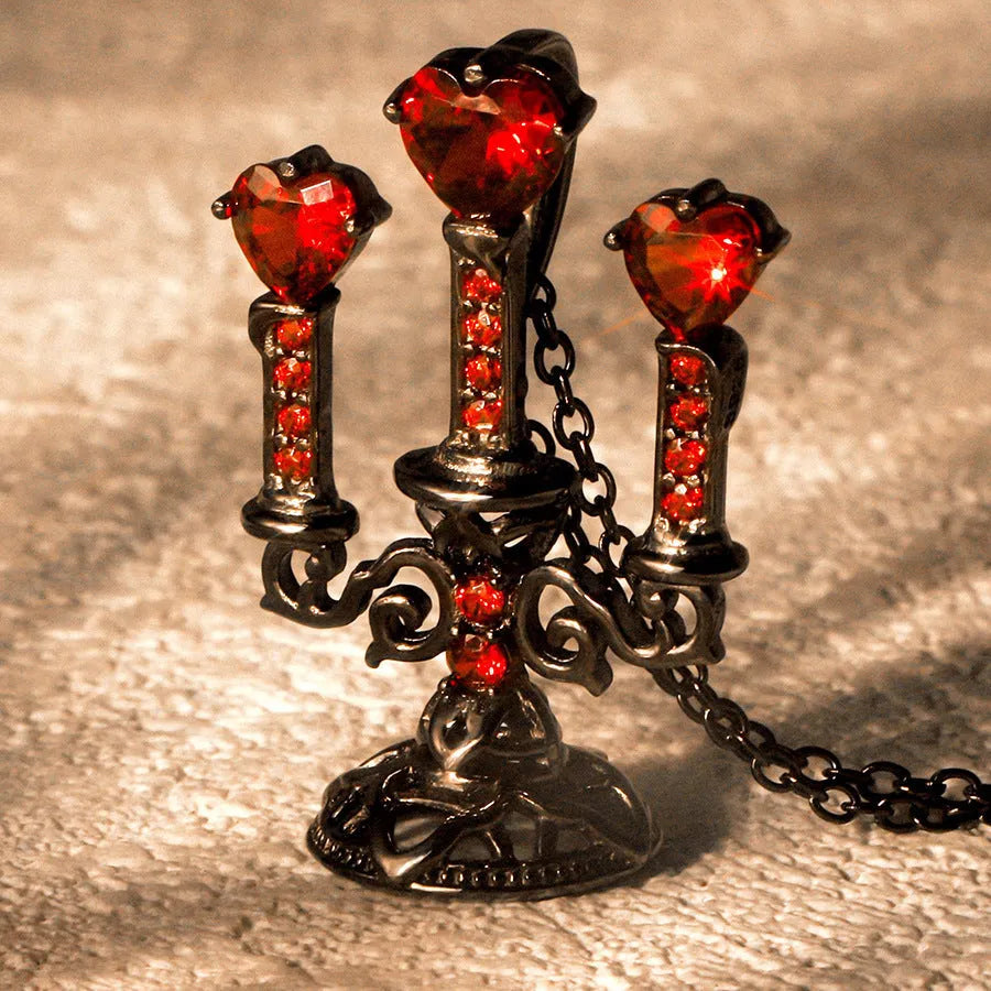 Women's retro candlestick pendant necklace on a gothic cross chain.