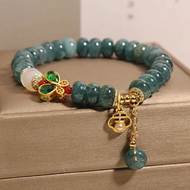 Women's blue water jade abacus bead bracelet with alloy inlay and butterfly charms